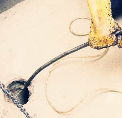 Corktown plumbers snaking a drain
