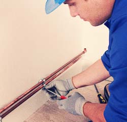 plumber in corso italia installing pipe