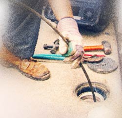 Roncesvalles plumber inspecting a drain