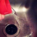 pouring liquid drain cleaner down the drain